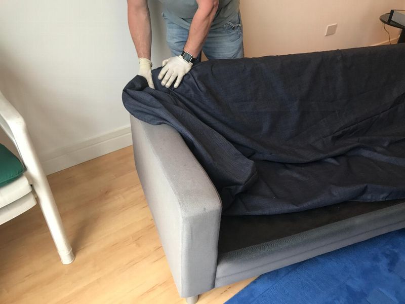 B&B Italia sofa having a navy loose cover fitted