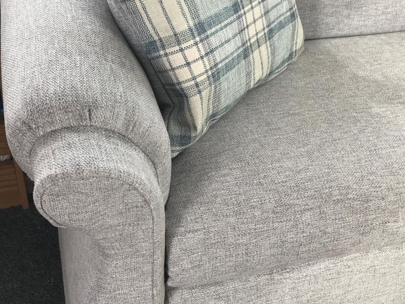 Close-up of a rolled arm on grey caravan seat covers