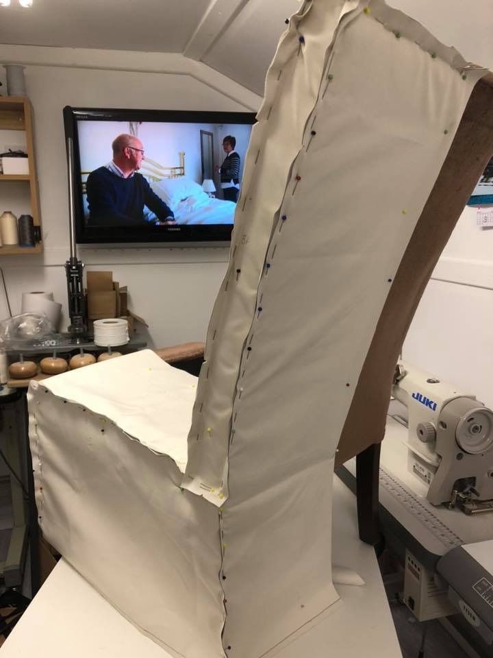 Calico toile pinned on a tall chair back during the course