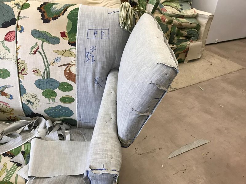 Pattern pieces marked on floral chintz for a country house cover