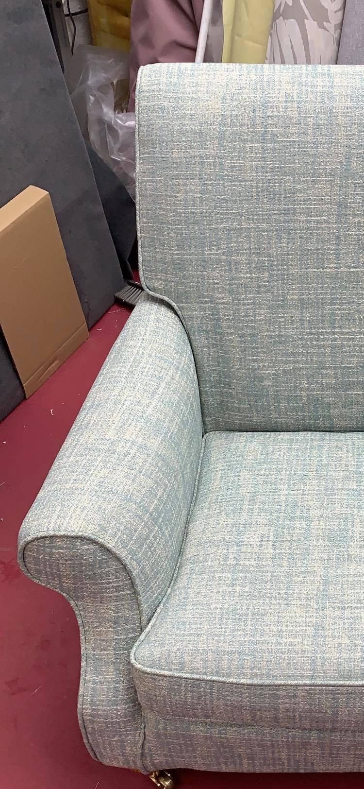 Scroll-arm chair cover in duck-egg tweed, close-up
