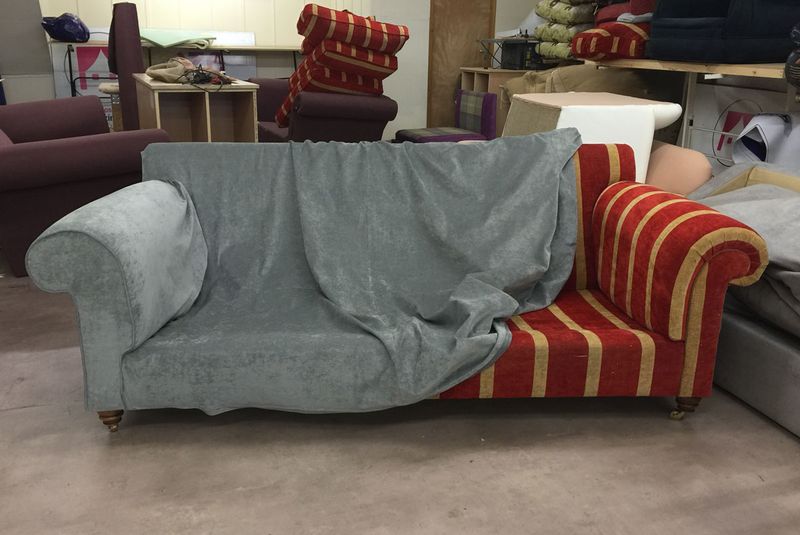 Duresta sofa having its new grey loose cover fitted over the old striped fabric