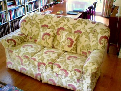 Ercol sofa loose cover in green and pink floral fabric