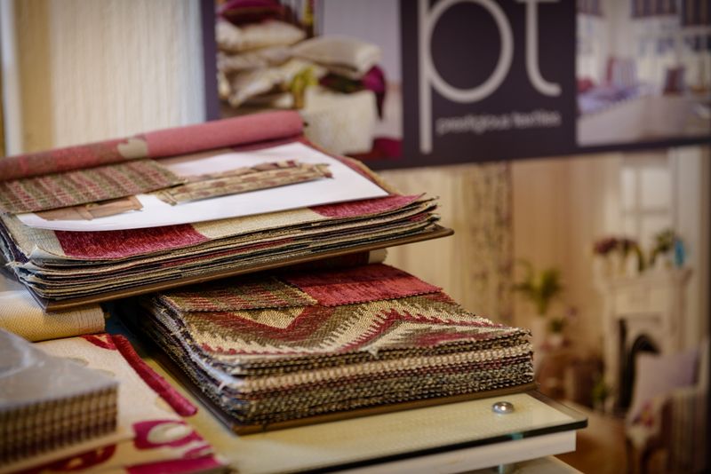 Fabric sample books on display for choosing a loose cover fabric