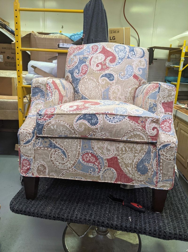 Armchair with a paisley print tailored loose cover made by Mary