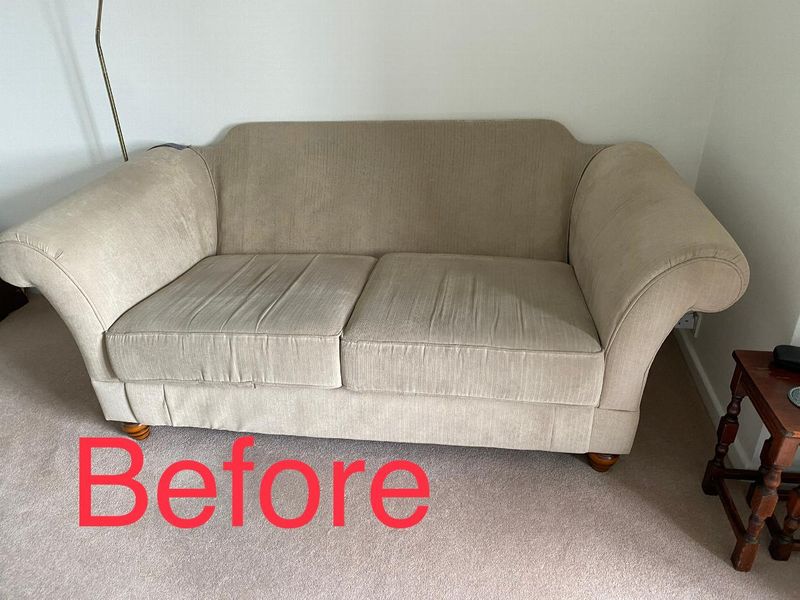 Multiyork sofa before its replacement loose covers, in worn beige