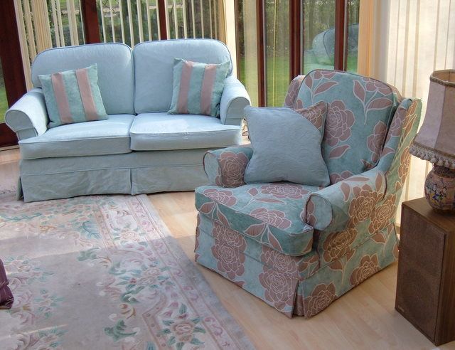 Pale blue sofa and striped armchair loose covers