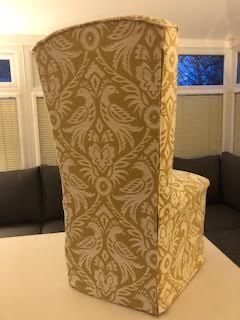 Back view of a gold damask chair cover made by Sonia