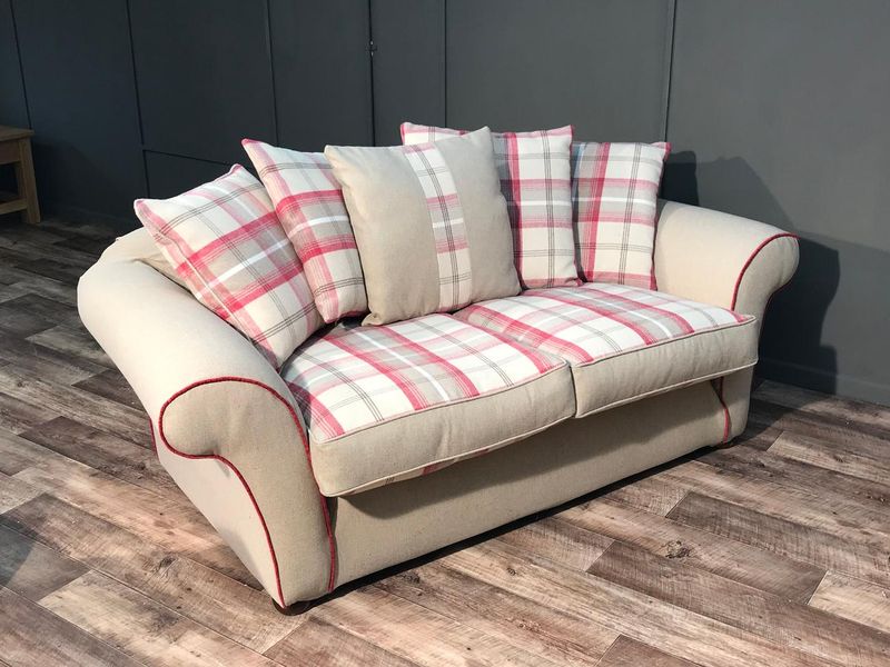 Tetrad sofa in a cream piped loose cover with check cushions