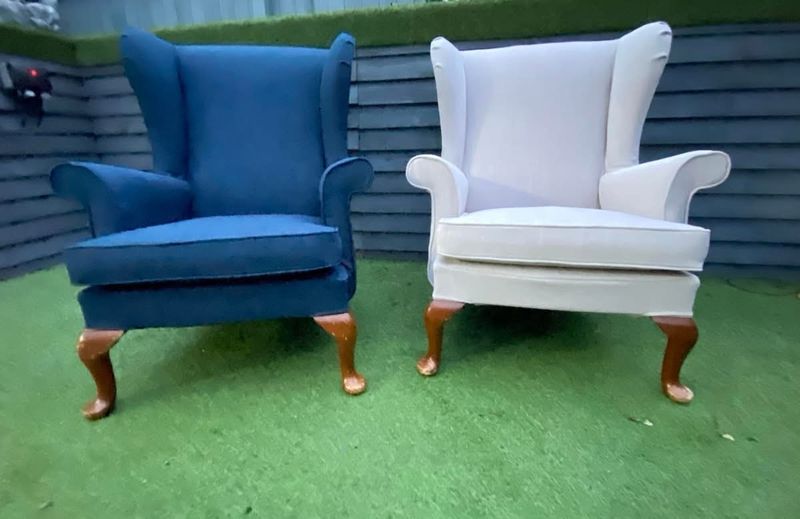 Two wingback armchairs with made-to-measure covers in navy and white